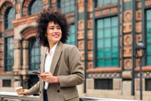 successful business woman smiling with a phone